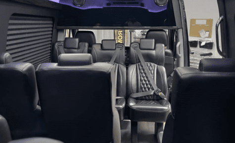 Interior view of premium black leather executive van seats for transportation